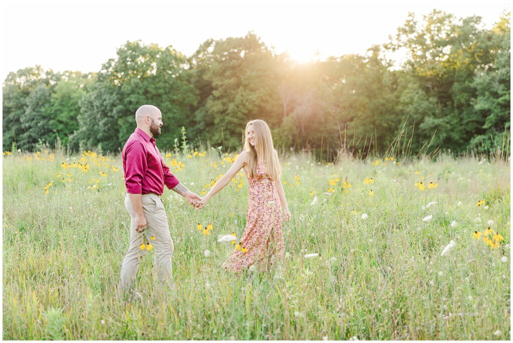 couple in field of wildflowers